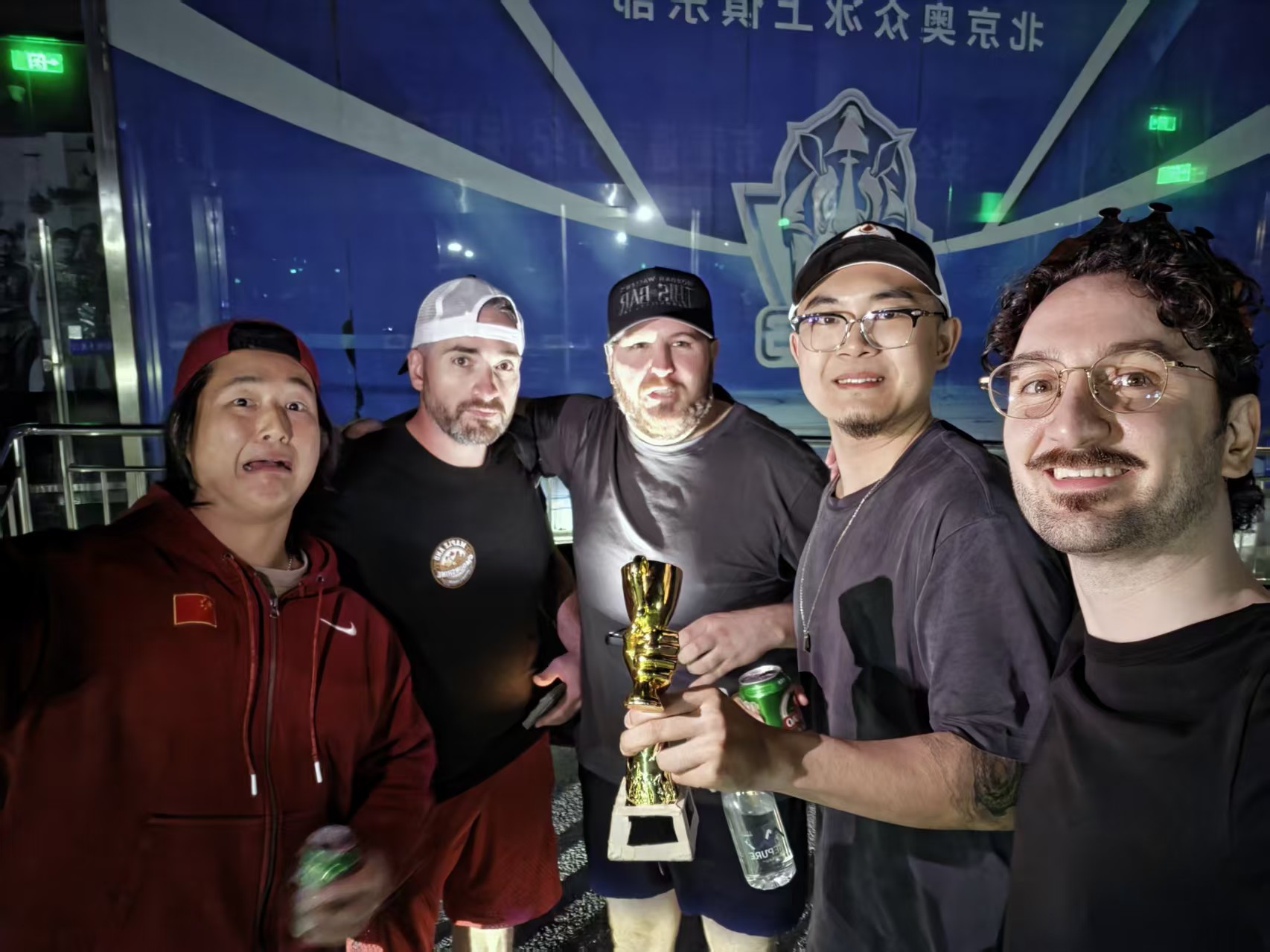Five BIIH players enjoying Sunday night with the Week 2 Parking Lot trophy